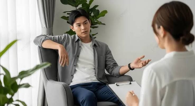 Client discussing a legal letter with a debt consultant